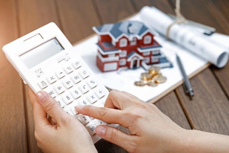 calculator and mini house with change