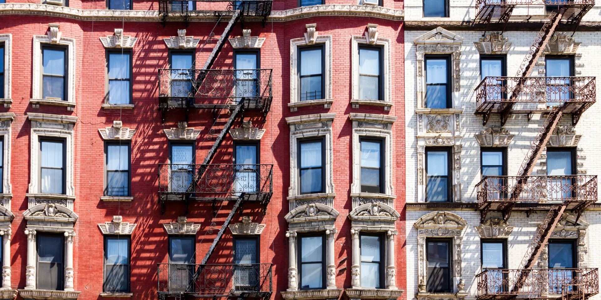 new york brick housing with fire escapes